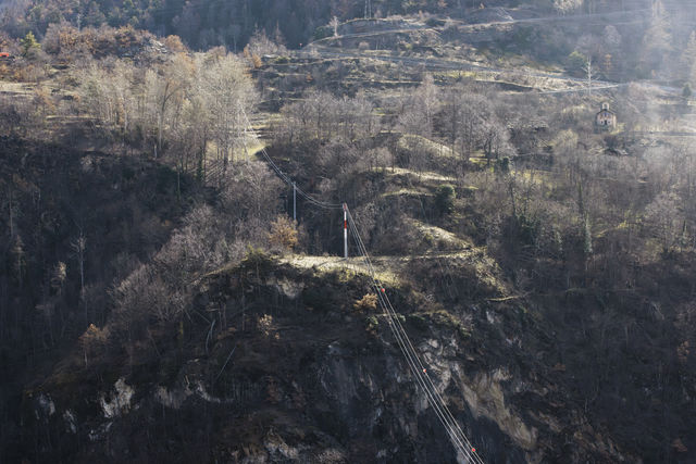 Cables crossing a rock face