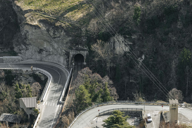 Curving road entering a tunnel
